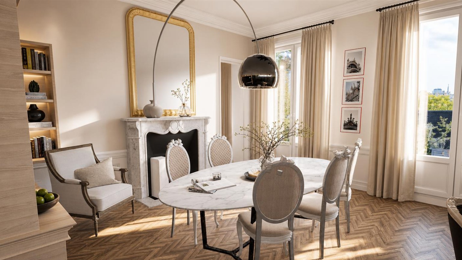 Salle à manger haussmannienne, table ovale en marbre, cheminée et grand miroir doré, bibliothèque en chêne clair